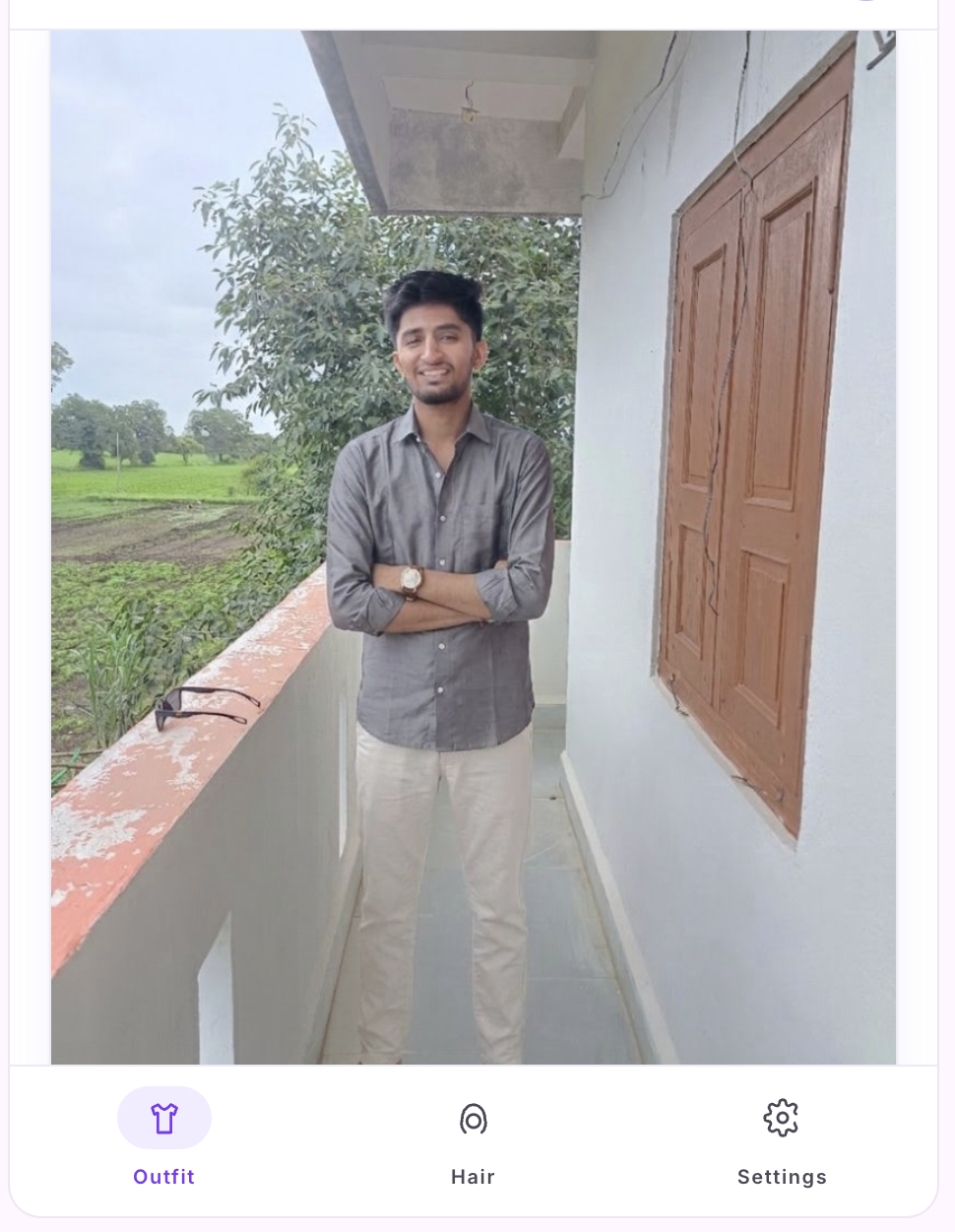 Try-on result — gray shirt with sunglasses on the user